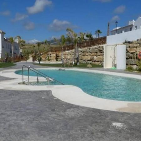 Agradable Casa Adosada Con Piscina Zahara de los Atunes Kültér fotó
